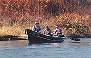 Three men in a boat